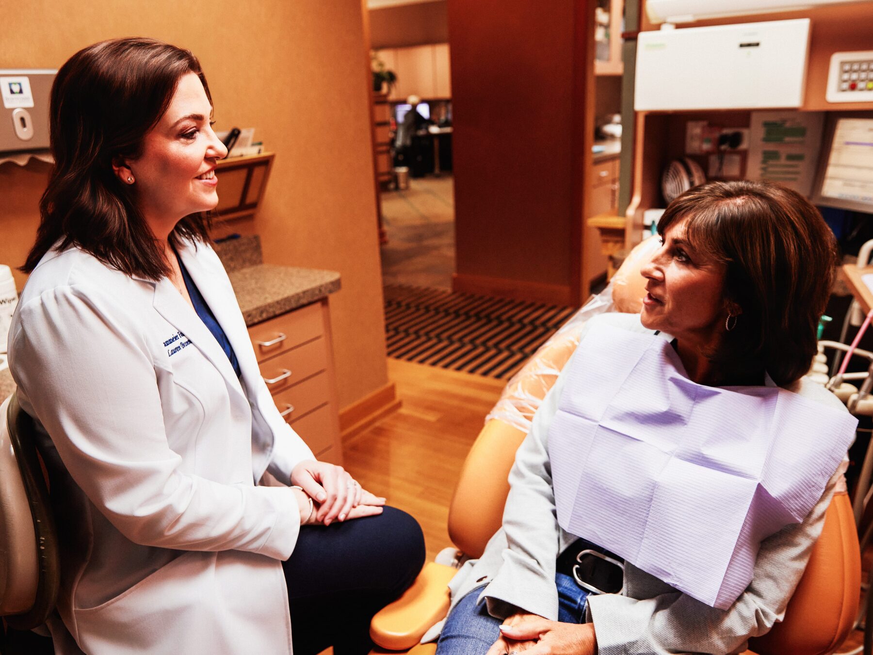 Dr. Brammeier discussing treatment plans with a patient in the operatory