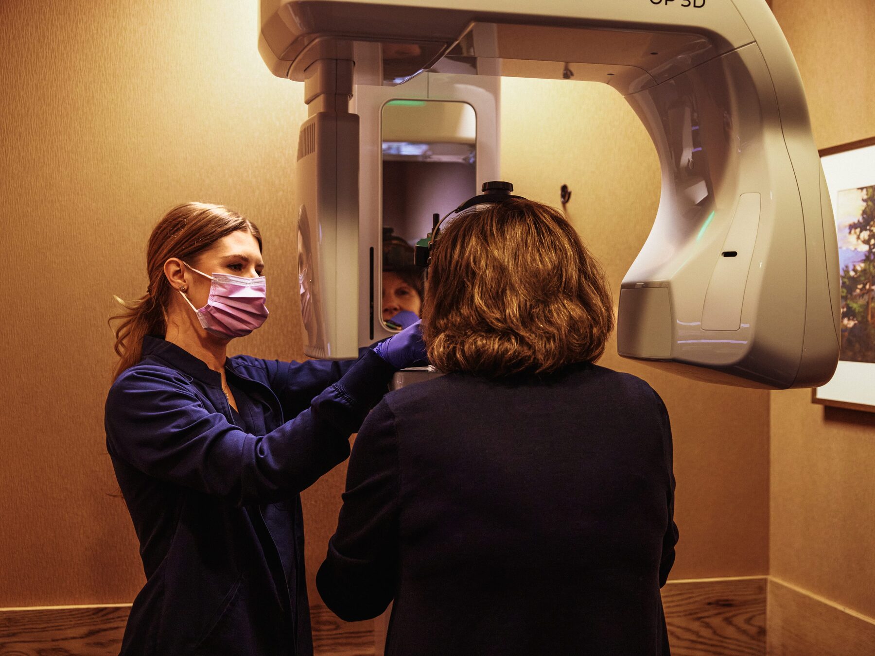 Patient receiving a DEXIS OP 3D panoramic / cone beam CT scan