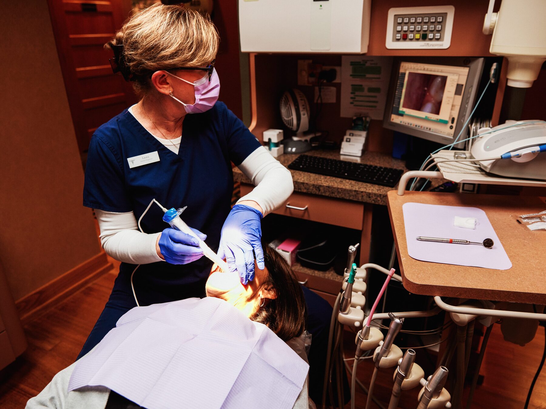Dental hygienist performing a professional cleaning